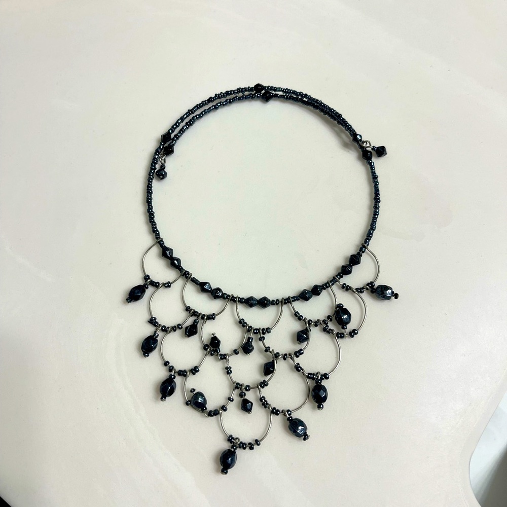 This beautiful choker is black beaded fit all sizes of neck